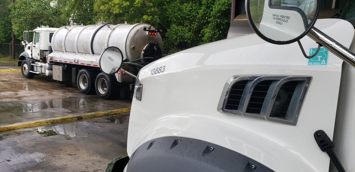 Close-up of a Class 7-8 truck cab and a fuel tanker